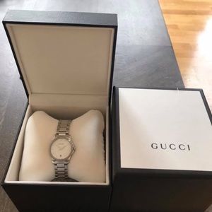 Selling woman’s authentic Gucci watch w/diamonds
